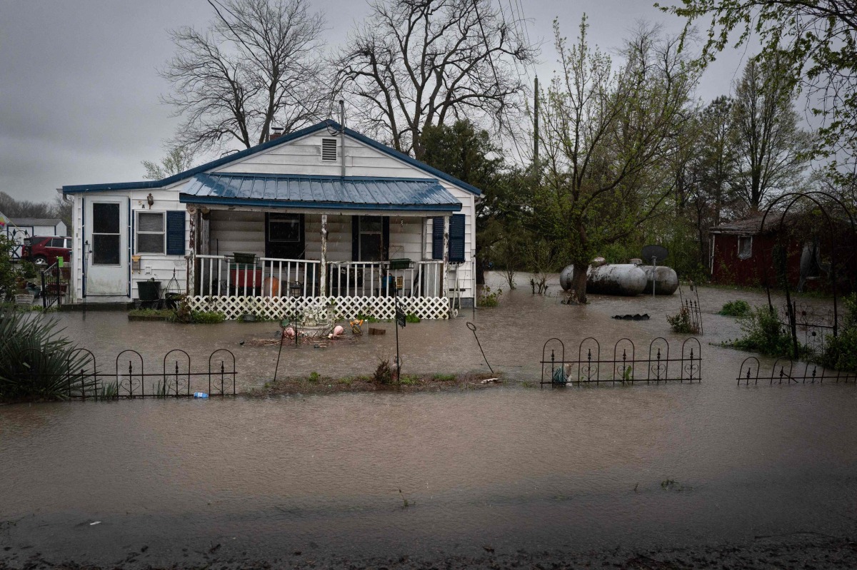 Water surrounds a home on April 05, 2025 in Wilson City, Missouri. Photo by SCOTT OLSON / GETTY IMAGES NORTH AMERICA / Getty Images via AFP