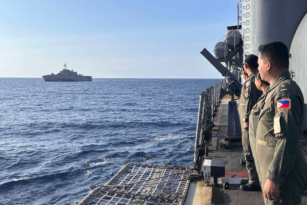 File photo: The USS Gabrielle Giffords receives passing honours by Philippine Navy Officers aboard BRP Gregorio Del Pilar during the 3rd AFP-USINDOPACOM Maritime Cooperative Activity in the disputed South China Sea. (Photo by Handout / Armed Forces of the Philippines' Western Command / AFP)