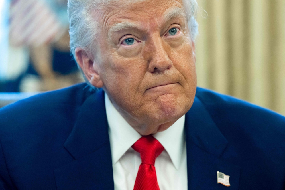 US President Donald Trump speaks after signing an executive order in the Oval Office of the White House on April 9, 2025 in Washington, DC. (Photo by Saul Loeb / AFP)