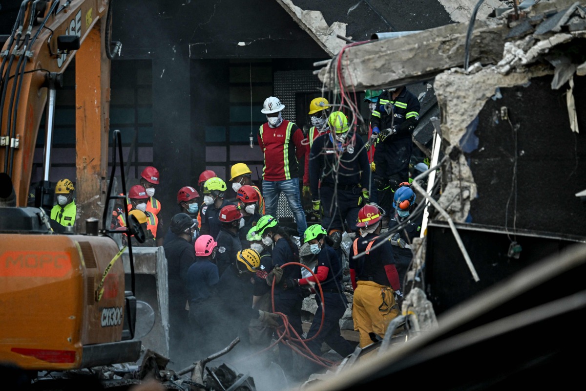 Rescue teams work at the Jet Set nightclub following the collapse of its roof in Santo Domingo on April 9, 2025. Photo by MARTIN BERNETTI / AFP
