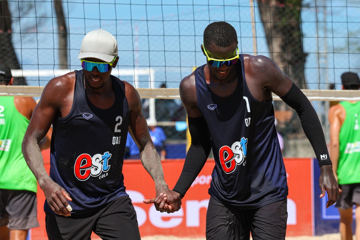 Qatar's Ahmed Tijan (left) Cherif Younousse celebrate a point.