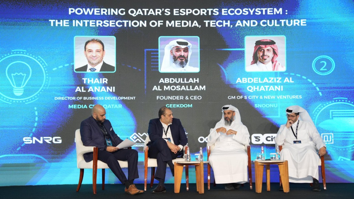 Officials attending a panel discussion.