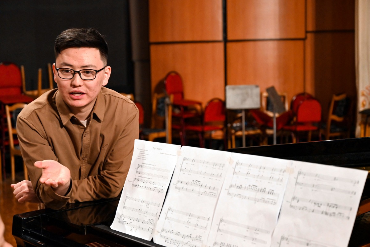 Nurzhyguit Moldoyar, singer, composer and student at the K. Moldobasanov Kyrgyz National Conservatory, who participates in a competition to create a new national anthem for Kyrgyzstan, together with fellow musicians and collaborators performs his composition he submitted to the contest, in Bishkek on April 5, 2025. Photo by Guliza Urustambek kyzy / AFP.
