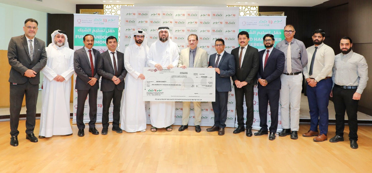 LuLu Hypermarket Qatar officials handing over the donation cheque.