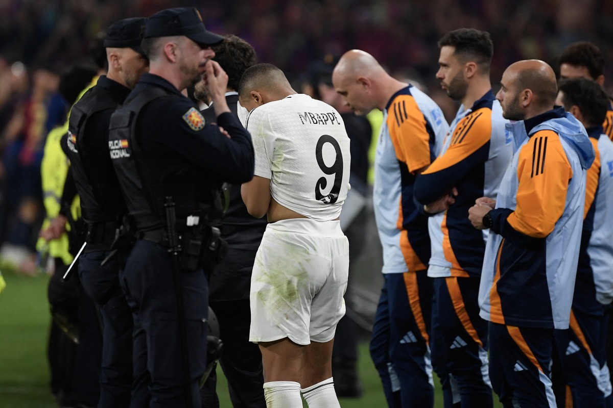 Real Madrid's French forward #09 Kylian Mbappe reacts after the Spanish Cup, Copa del Rey (King's Cup) final football match between FC Barcelona and Real Madrid CF at La Cartuja stadium in Seville on April 26, 2025. (Photo by Josep LAGO / AFP)
