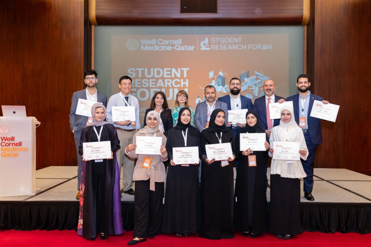 A group of award-winning students with their mentors.