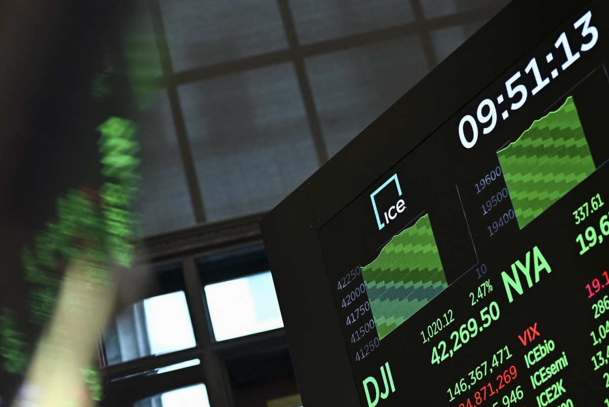 A screen displays trading numbers at the New York Stock Exchange (NYSE) at the opening bell on May 12, 2025 in New York City. (Photo by ANGELA WEISS / AFP)