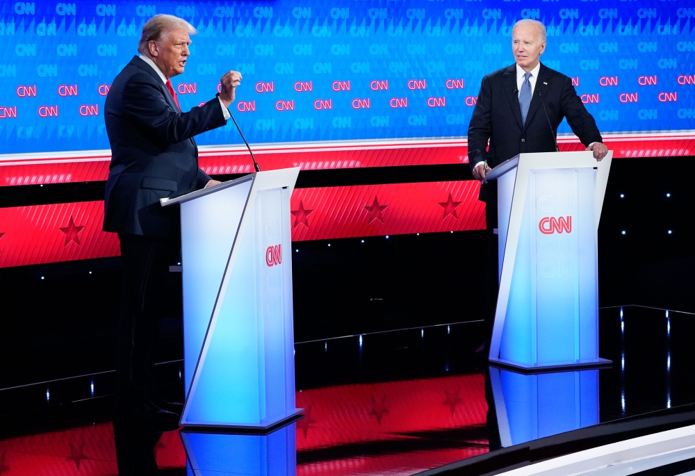 Donald Trump and Joe Biden debate at CNN’s studios in Atlanta on June 27. (Photo by Jabin Botsford/The Washington Post)