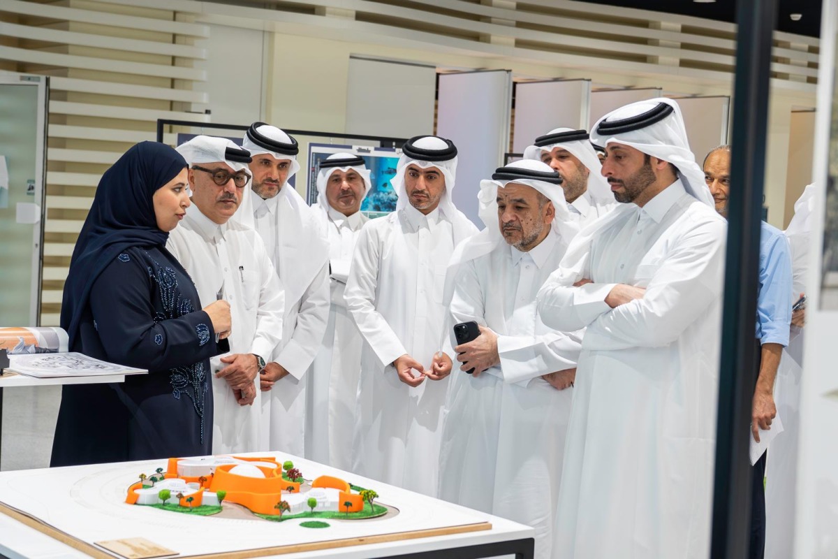 Minister of Municipality H E Abdullah bin Hamad bin Abdullah Al-Attiya and QU President Dr. Omar Al-Ansari with other officials touring the exhibition.