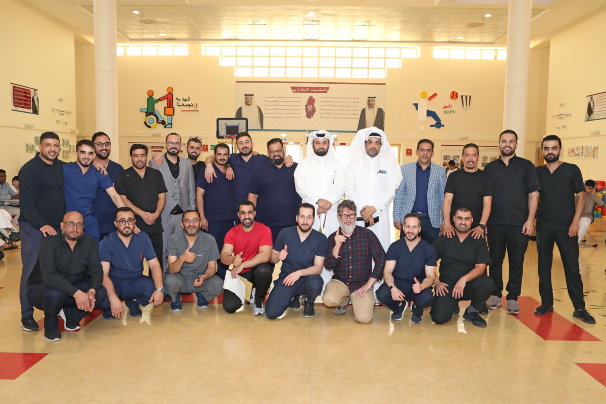 Sheikh Abdulla Bin Zaid Al-Mahmoud Islamic Cultural Center officials with participants during an activity. 