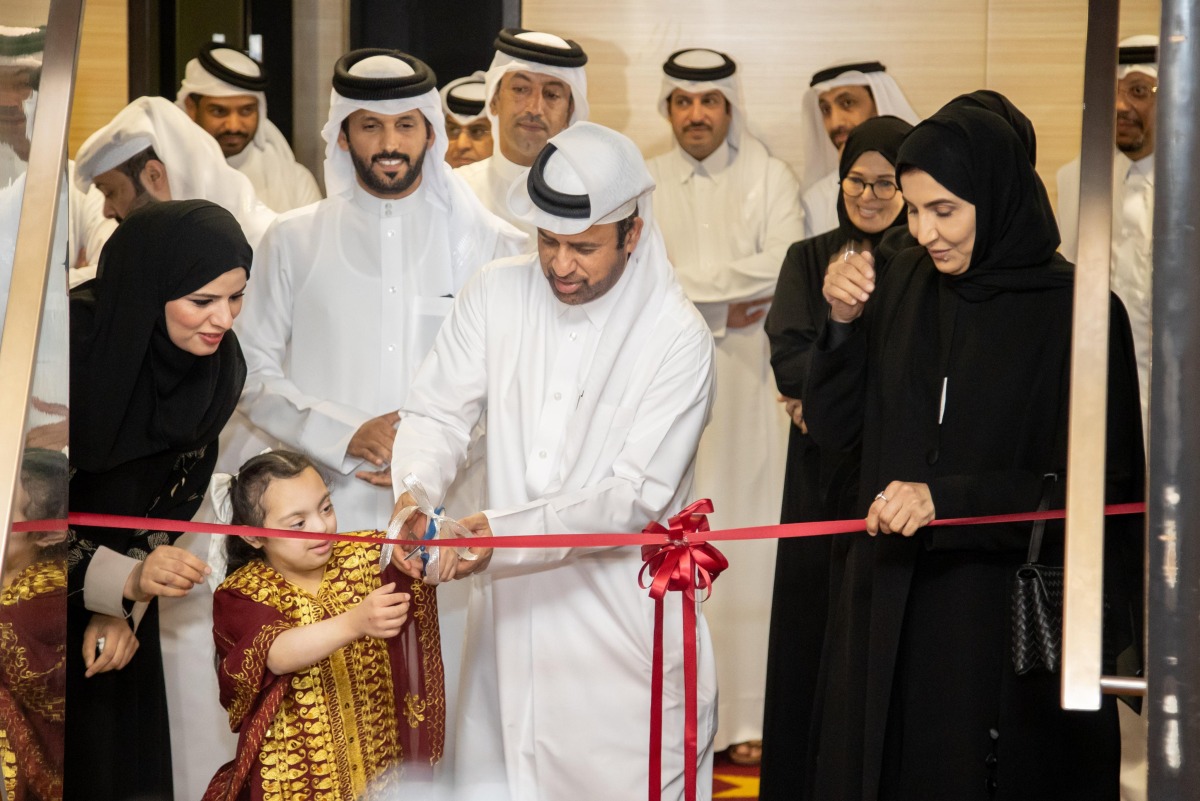 Katara General Manager Prof. Dr. Khalid bin Ibrahim Al Sulaiti joins a student in inaugurating the exhibition yesterday.