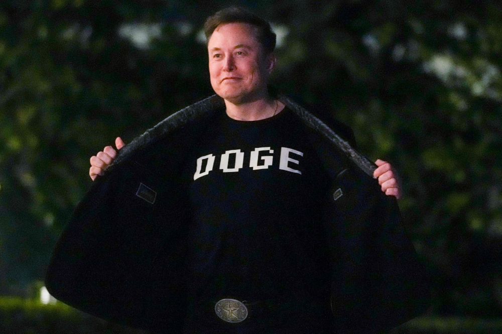 (Files) Elon Musk shows off a shirt that says 
