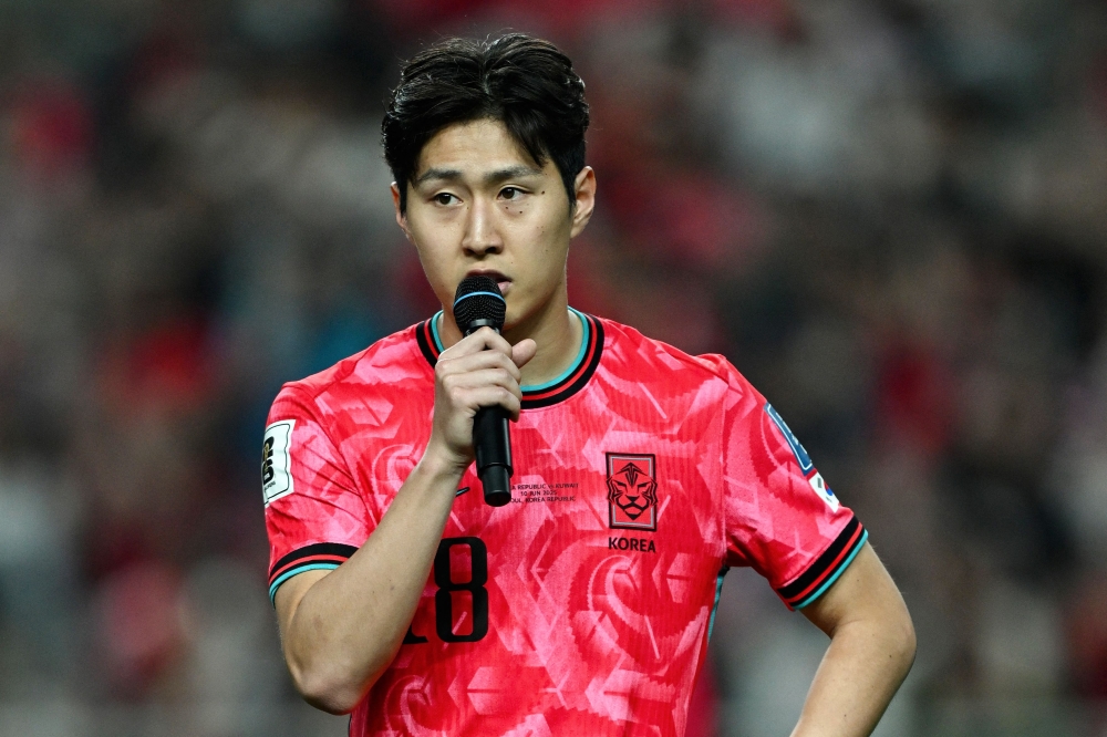 South Korea's Lee Kang-in addresses fans after the team's win against Kuwait on June 10, 2025. (Photo by Jung Yeon-je / AFP)
