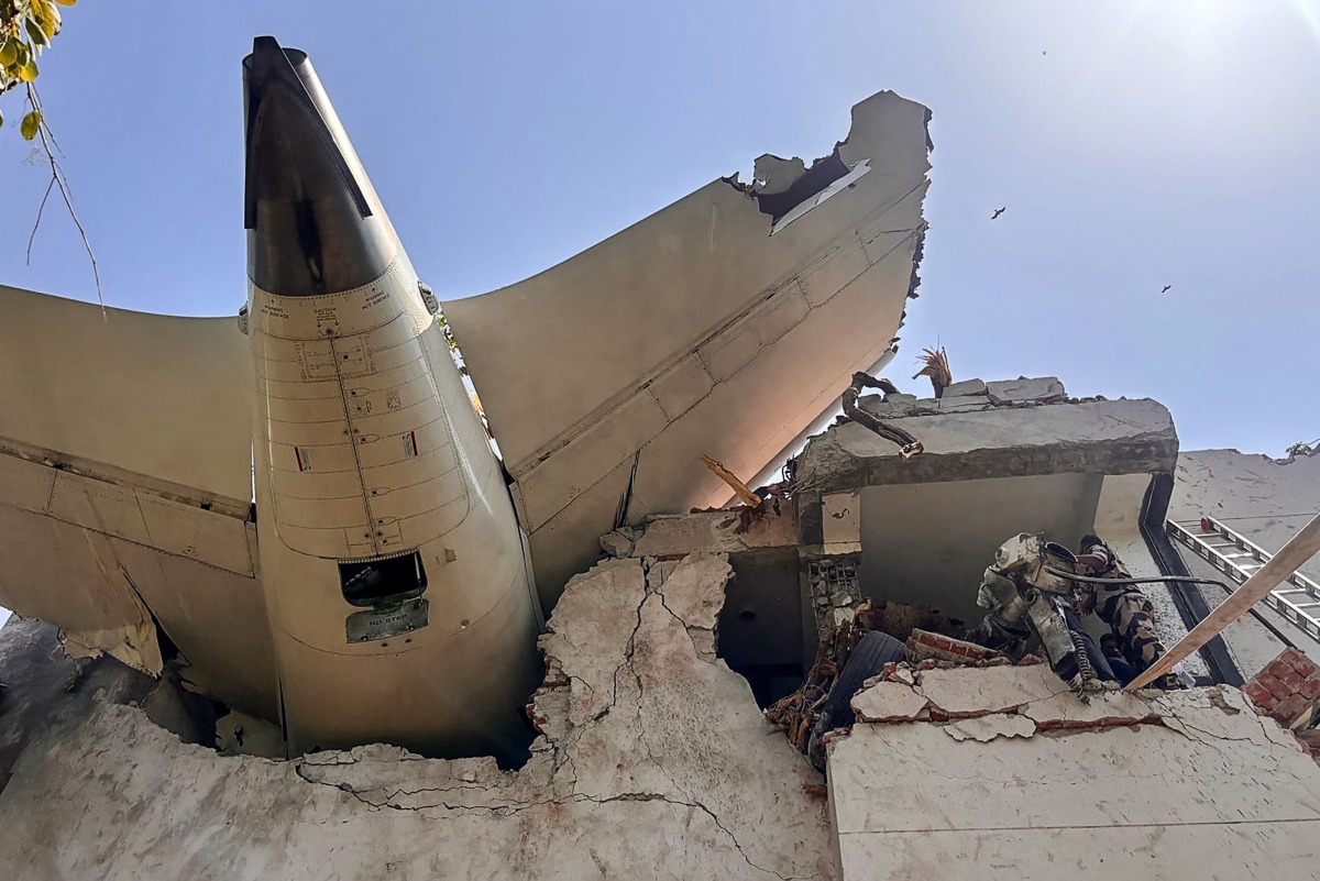 This handout taken and posted on the X (formerly Twitter) account of the Central Industrial Security Force (CISF) On June 12, 2025 shows the back of AN Air India plane after it crashed in a residential area near the airport in Ahmedabad. (Photo by Handout / CENTRAL INDUSTRIAL SECURITY FORCE (CISF) / AFP) 