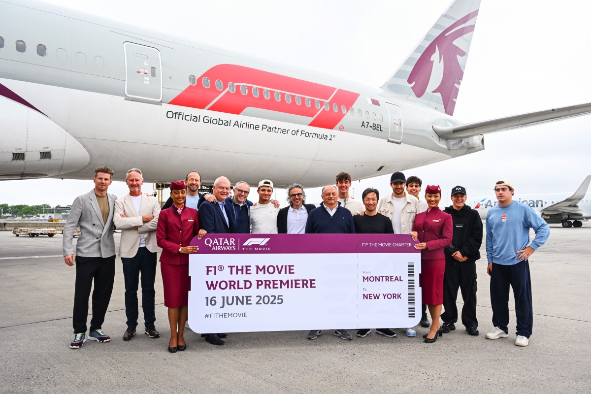 Qatar Airways crew with the F1 drivers and team principals during the trip.