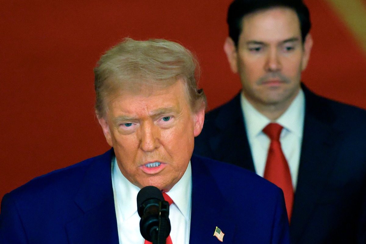 US President Donald Trump addresses the nation, alongside US Secretary of State Marco Rubio (R) from the White House in Washington, DC on June 21, 2025. (Photo by Carlos Barria / POOL / AFP)
