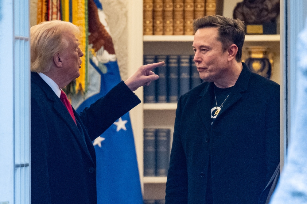 US President Donald Trump and Elon Musk in the Oval Office before departing the White House in Washington, DC, on the way to Trump's residence at Mar-a-Lago in Palm Beach, Florida on March 14, 2025. (Photo by Roberto Schmidt / AFP)