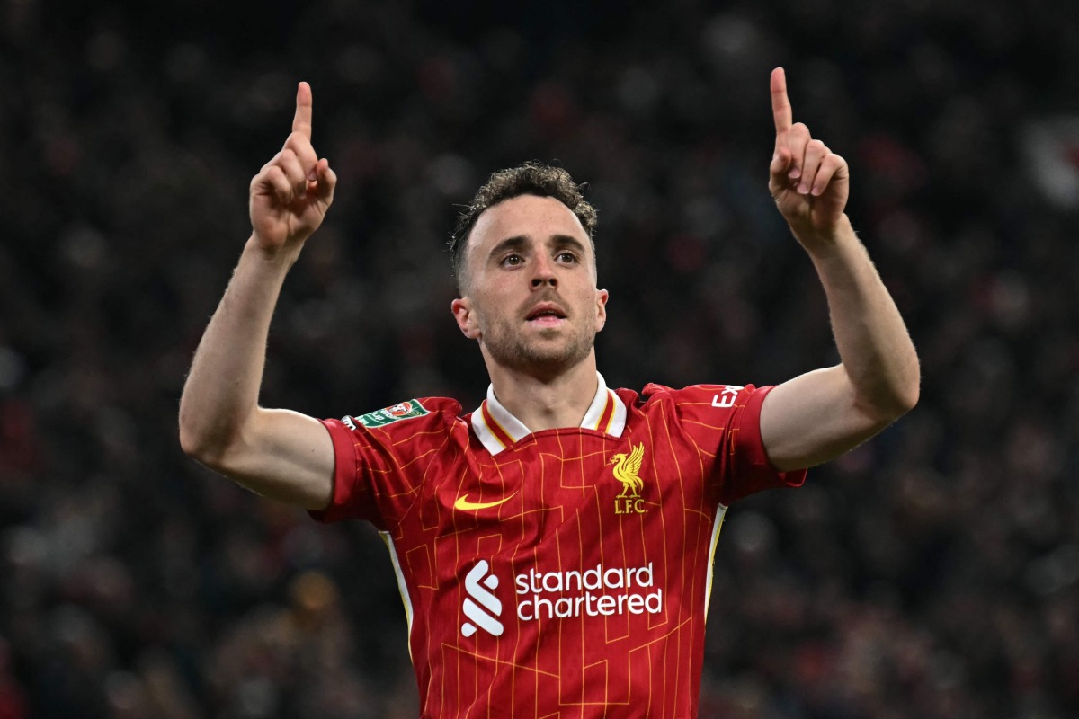 Liverpool's Portuguese striker #20 Diogo Jota celebrates after scoring a goal during the English League Cup third round football match between Liverpool and West Ham United at Anfield in Liverpool, north west England on September 25, 2024. Photo by Paul ELLIS / AFP