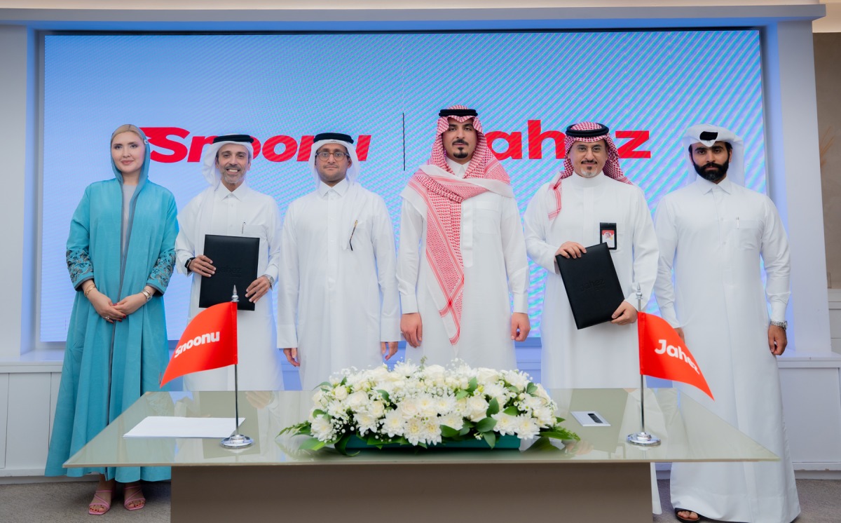 Officials from Snoonu and Jahez Group during the event.