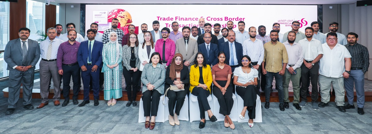 Commercial Bank officials pose for a group photo during the workshop.