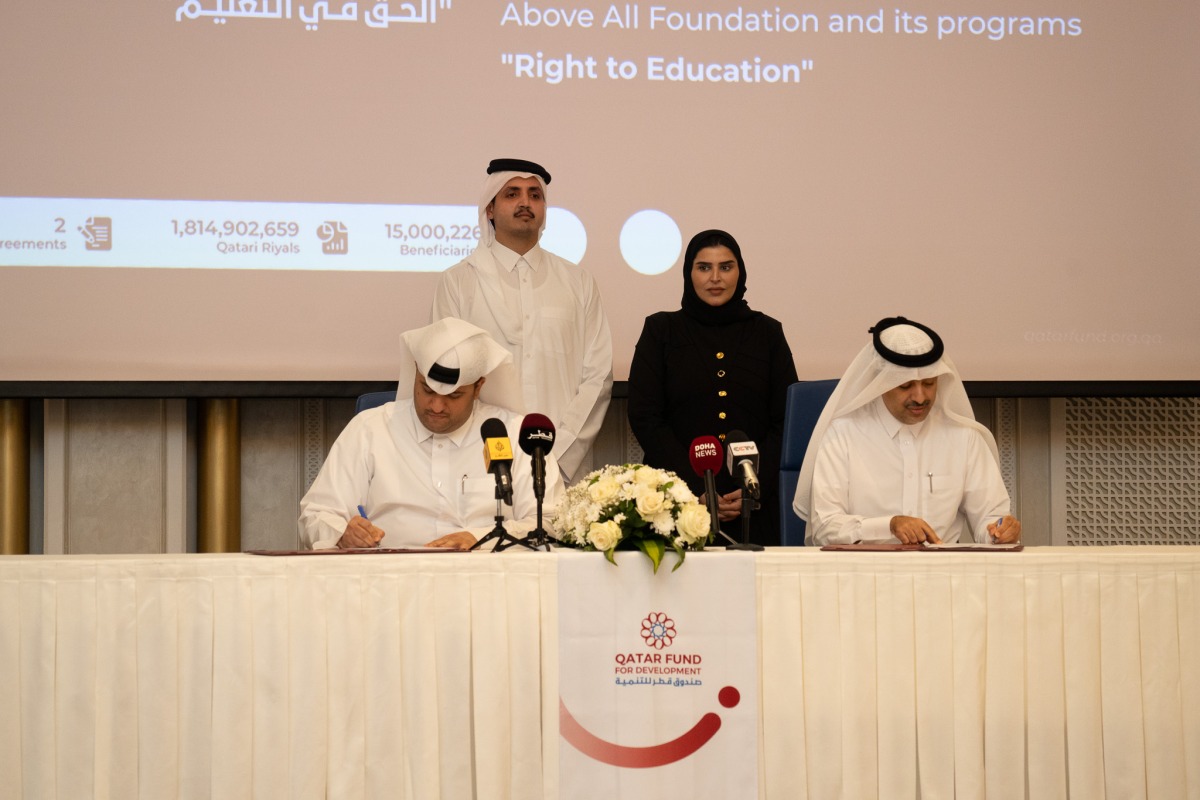 Chairman of the Board of Directors for QFFD H E Sheikh Thani bin Hamad Al Thani and Minister of State for International Cooperation at the Ministry of Foreign Affairs and Vice Chairman of the Board of Directors of QFFD H E Maryam bint Ali bin Nasser Al-Misnad witnessing an agreement signing by QFFD Director General Fahad Al-Sulaiti and Qatar Charity CEO Yousef Al-Kuwari during the event yesterday.