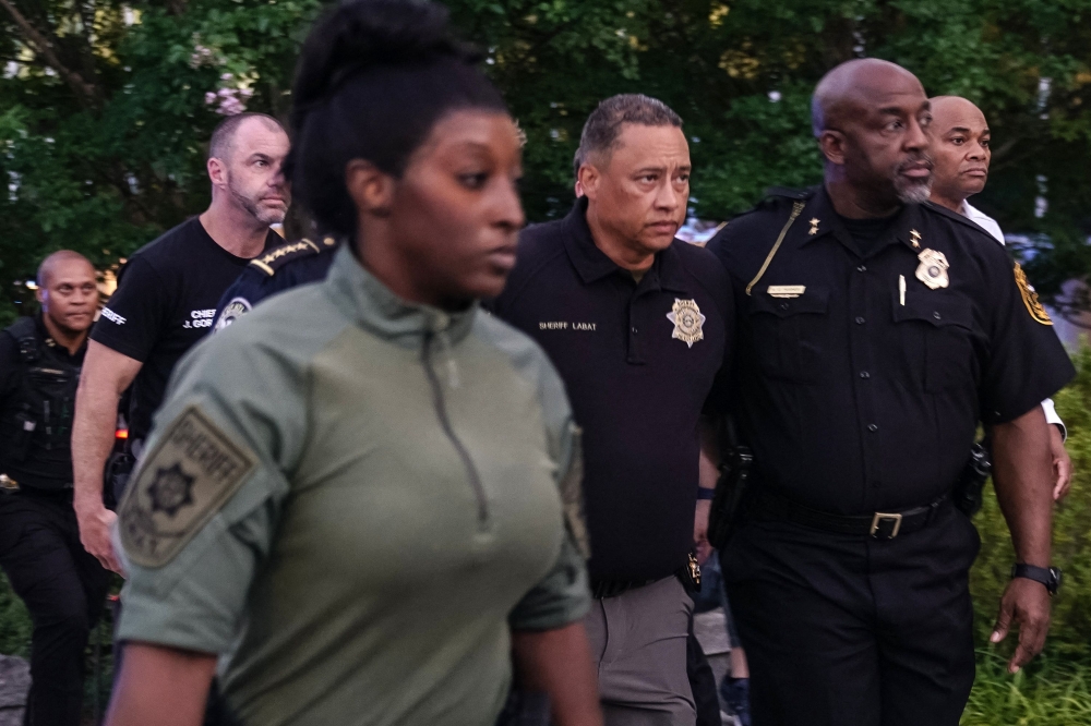 Law enforcement arrive at a press conference regarding an active shooter incident on August 8, 2025 in Atlanta, Georgia. Elijah Nouvelage/Getty Images/AFP
