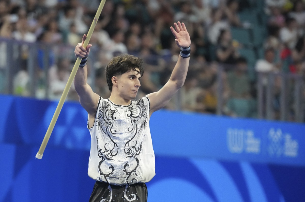 Shahin Banitalebi of Iran greets the spectators after the men's Nanquan-Nangun final of Wushu event at the World Games 2025 in Chengdu, southwest China's Sichuan Province, Aug. 8, 2025. (Xinhua/Xu Suhui)
