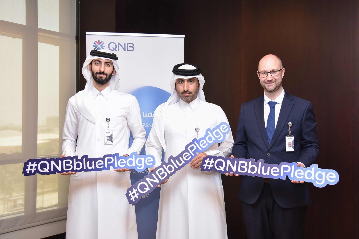 QNB officials pose for a photo during the campaign.