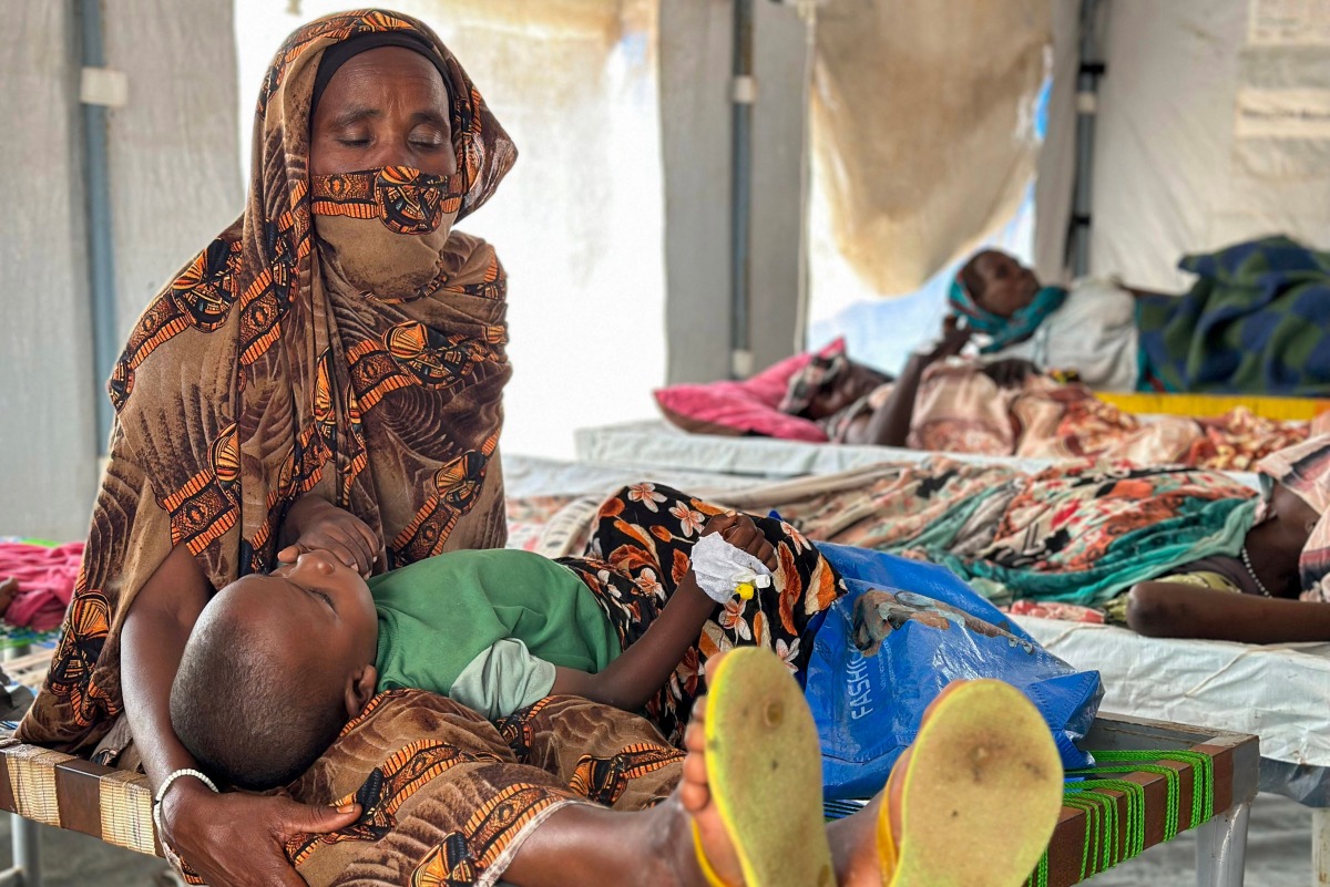 Cholera infected patients receive treatment in the cholera isolation centre at the refugee camps of western Sudan, in Tawila city in Darfur, on August 14, 2025. At least 40 people have died in Sudan's Darfur region in the country's worst cholera outbreak in years, Doctors Without Borders (MSF) said on August 14. (Photo by AFP)
