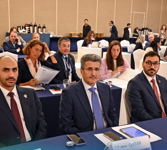 Acting President of QCAA, Mohamed Faleh Al Hajri, and other delegates at the event.