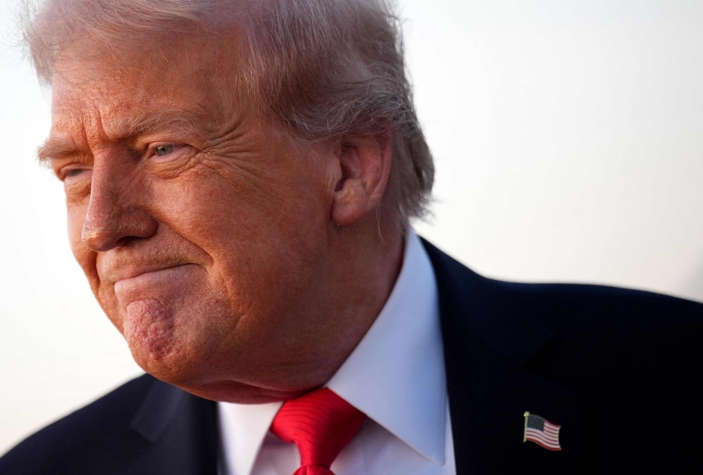 US President Donald Trump speaks to reporters after stepping off Air Force One on September 7, 2025 at Joint Base Andrews, Maryland. Kevin Dietsch/Getty Images/AFP