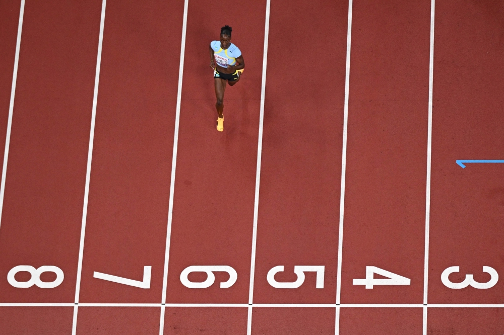 Saint Lucia's athlete Julien Alfred competes in the women's 100m heats during the World Athletics Championships in Tokyo on September 13, 2025. (Photo by Jewel Samad / AFP)