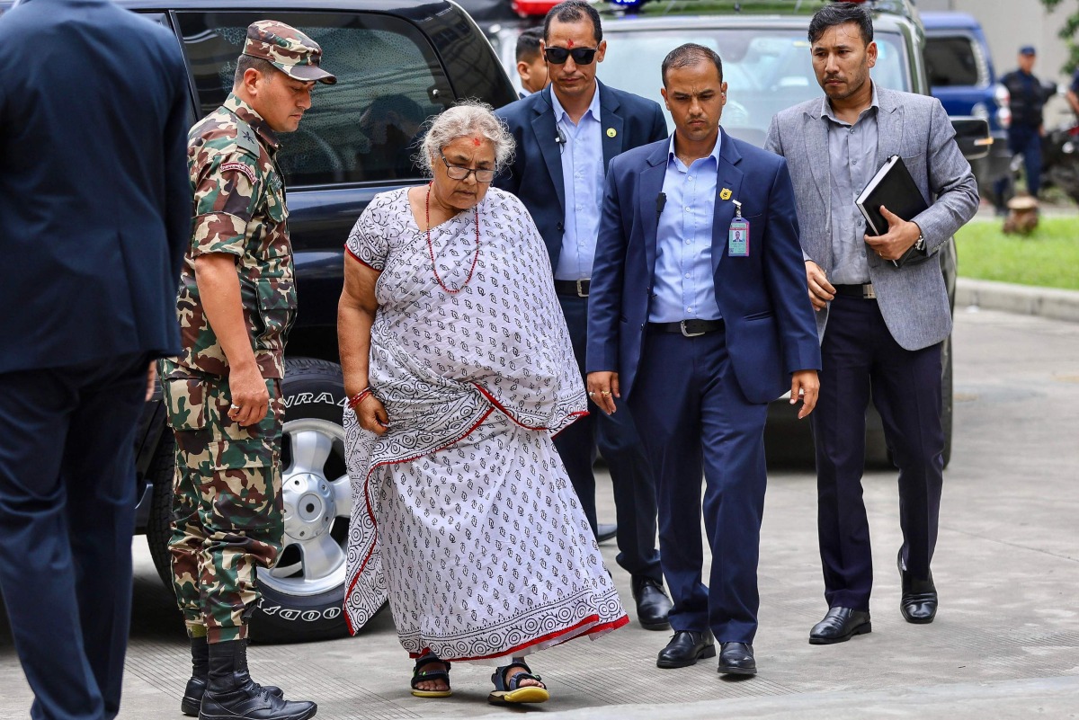 Newly-elected Prime Minister of Nepal痴 interim government Sushila Karki (2L) arrives at the Civil Service Hospital to visit victims injured during clashes with security personnel, in Kathmandu on September 13, 2025. (Photo by Prabin RANABHAT / AFP)
