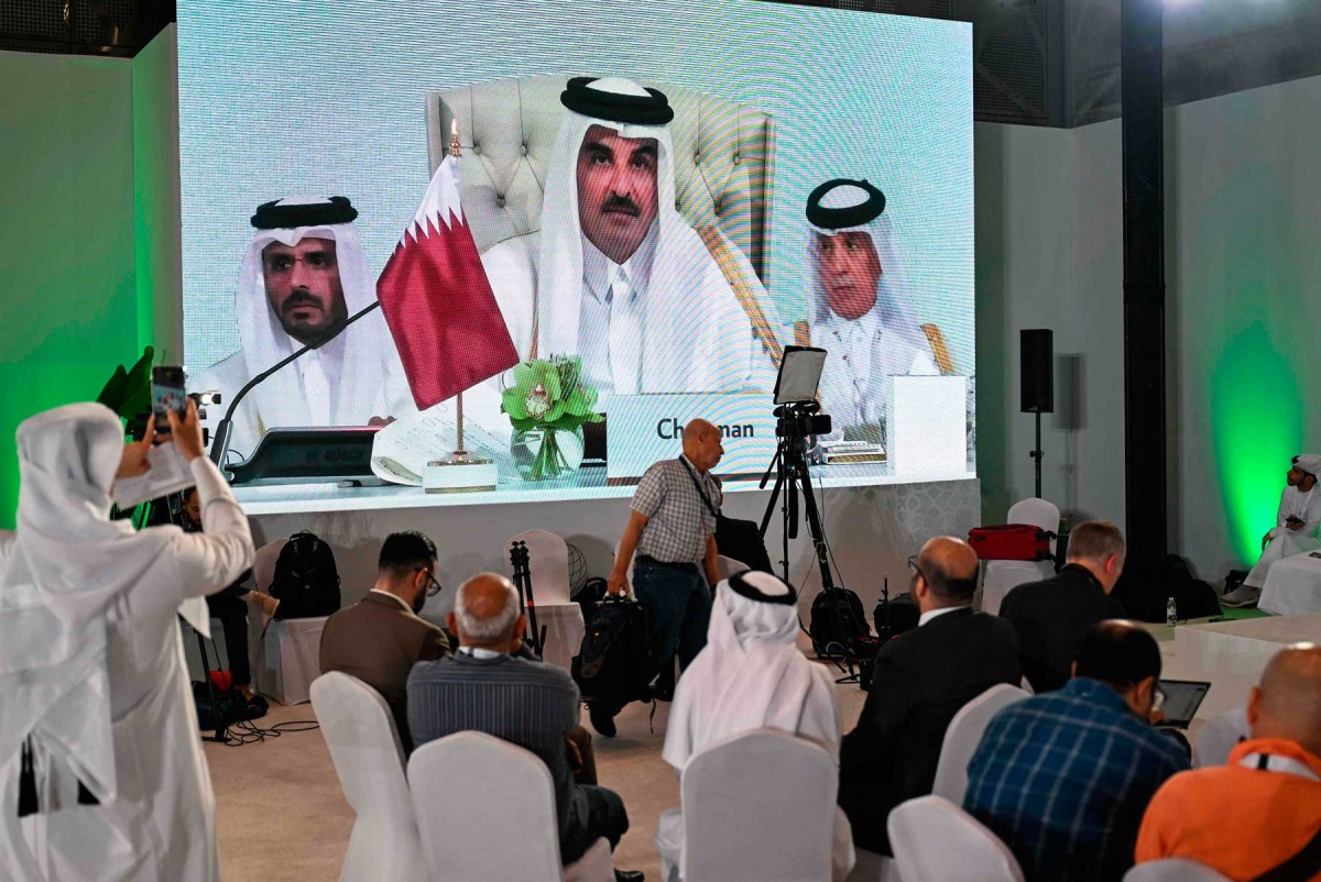 Reporters follow HH the Amir Sheikh Tamim bin Hamad Al-Thani's address at the media centre, during the opening of the 2025 Arab-Islamic emergency summit in Doha on September 15, 2025. Photo by Mahmud Hams / AFP