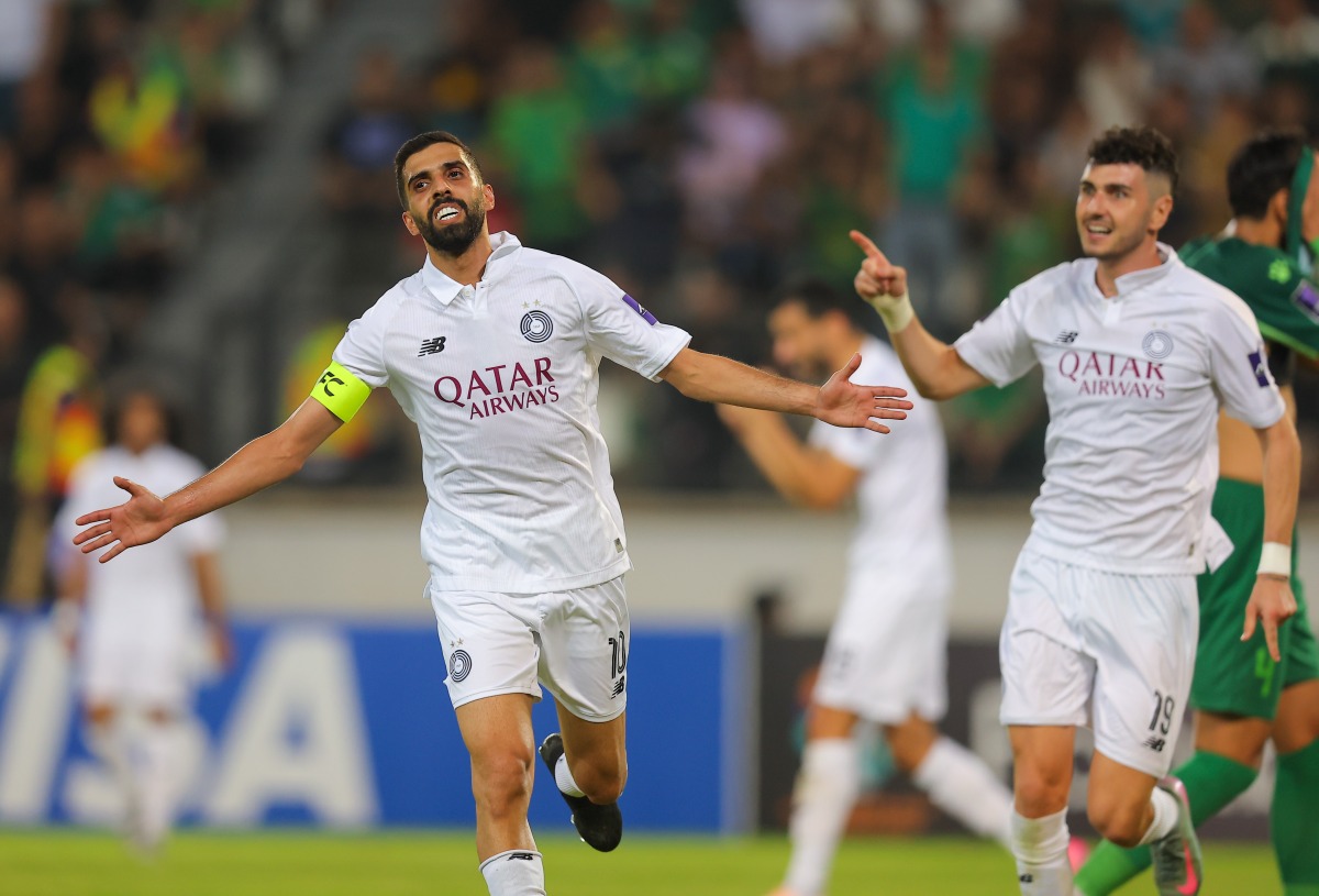 Qatar's Hassan Al Haydos celebrates after scoring the equaliser.