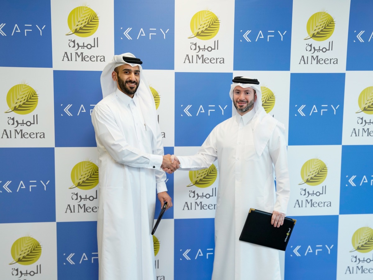 Chief Executive Officer of Al Meera Jassim Al Ansari (left) and Founder and CEO of Kafy, Khalifa Al-Sada, at the MoU signing.  
