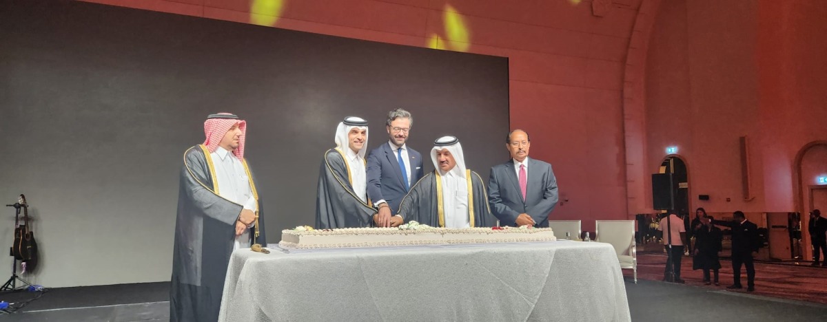Minister of Transport H E Sheikh Mohammed bin Abdulla bin Mohammed Al Thani; Secretary-General of the Ministry of Foreign Affairs (MoFA) H E Dr. Ahmed bin Hassan Al Hammadi and Spain's Ambassador to Qatar H E Álvaro Renedo Zalba cutting the cake to mark the occasion, while Director of the Department of Protocol at MoFA H E Ibrahim Yousif Abdullah Fakhro and Ambassador of Eritrea to Qatar and Dean of the Diplomatic Corps H E Ali Ibrahim Ahmed look on.