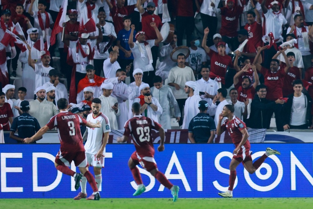 Qatar's defender #2 Pedro Miguel celebrates scoring his team's second goal during the FIFA World Cup 2026 Asian qualifier football match between Qatar and the UAE at Jassim Bin Hamad Stadium in Doha on October 14, 2025. (Photo by Karim Jaafar / AFP)