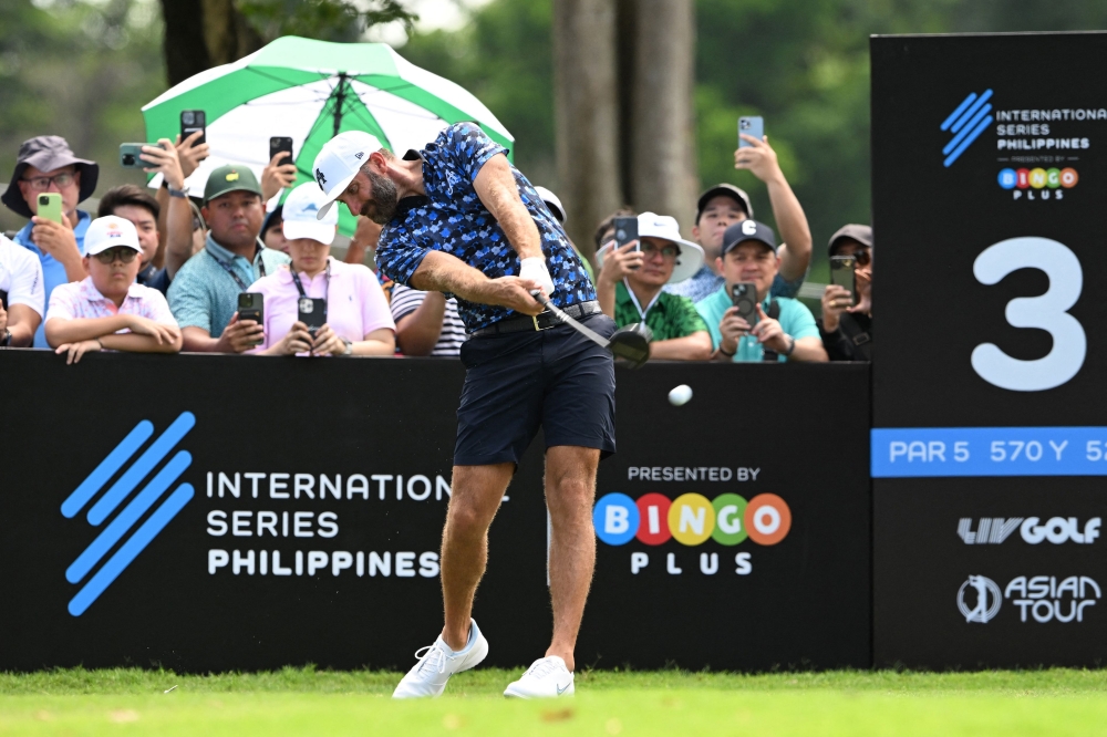 Dustin Johnson of the US tees during the International Series Philippines at Sta Elena Golf Club in Santa Rosa town, Laguna province, south of Manila on October 23, 2025. (Photo by Ted Aljibe / AFP)