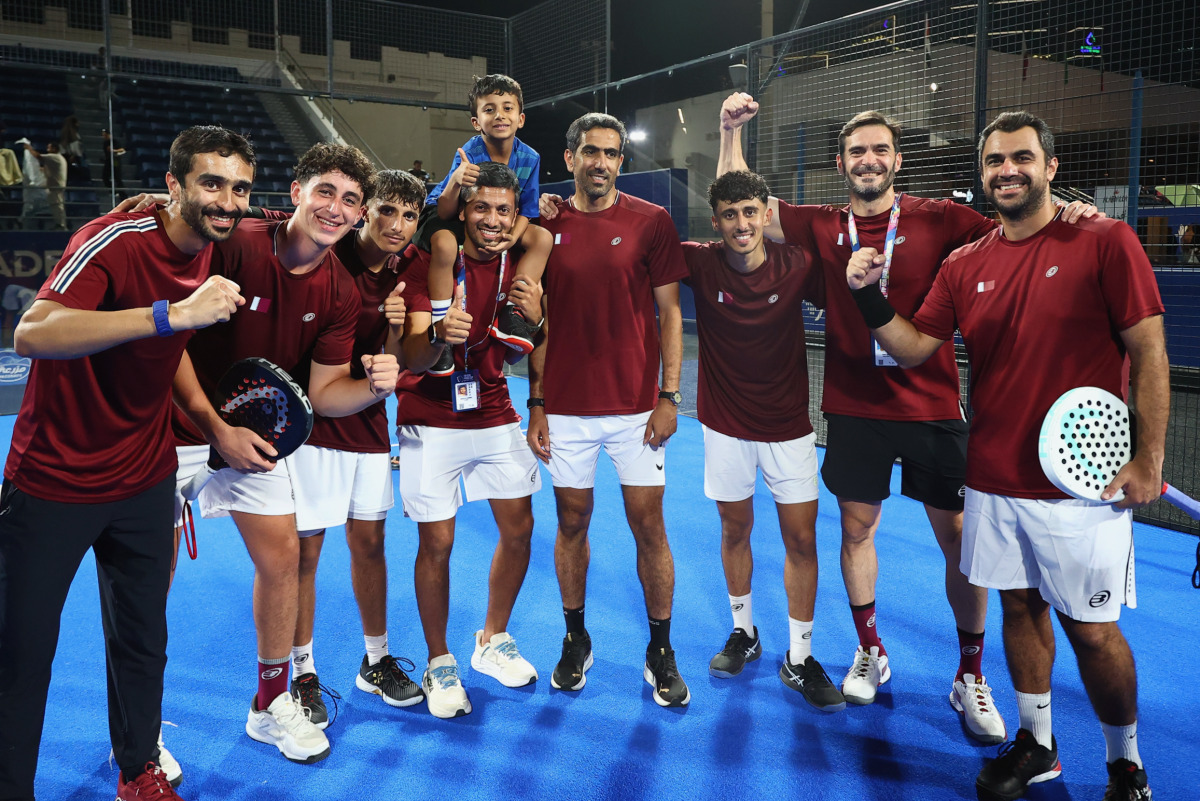 Qatar players and officials celebrate after qualifying for the final.