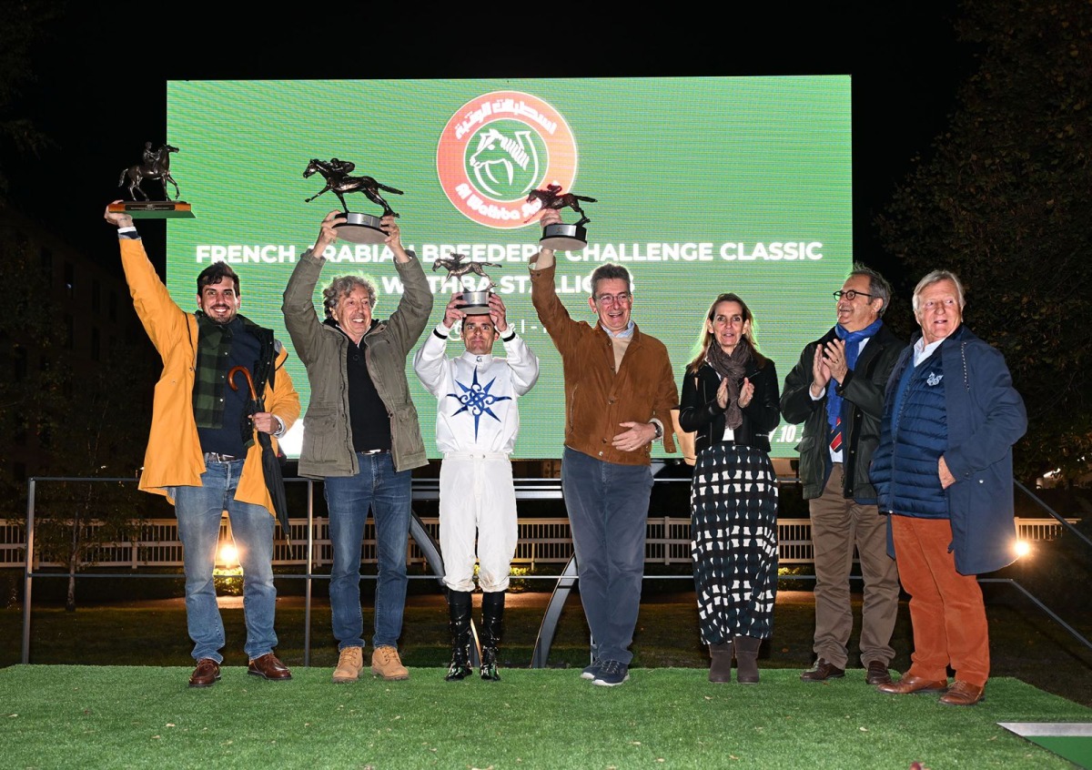 The connections of Geneva celebrate with their trophies.