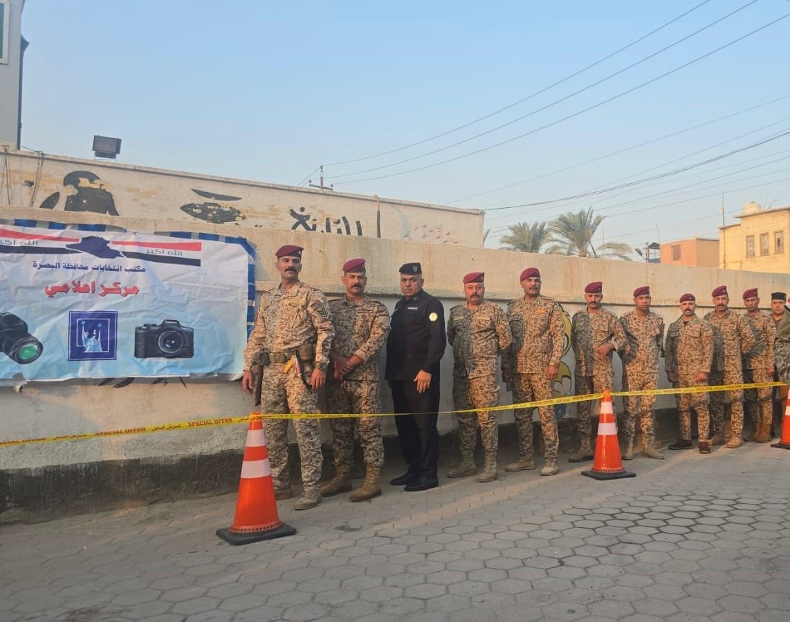 Security personnel waiting in line to vote in Iraq