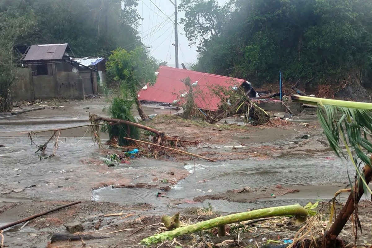 This handout photo taken and released by RG Jomark Omayan on November 9, 2025 shows a damaged home as Super Typhoon Fung-Wong moved towards the coast in Viga, Catanduanes province. Nearly a million people have been evacuated and floodwaters were rising in the Philippines on November 9 before Typhoon Fung-wong's expected late-night landfall on the east coast. (Photo by Handout / Courtesy of RG Jomark Omayan / AFP)