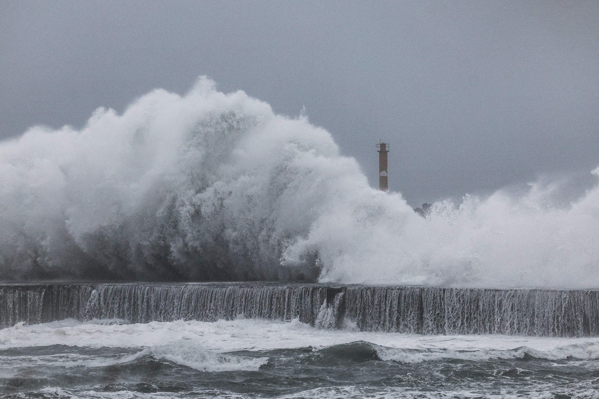 Strong waves crash against the sea wall in Yilan on November 11, 2025, as Typhoon Fung-Wong approaches. (Photo by I-Hwa Cheng / AFP)