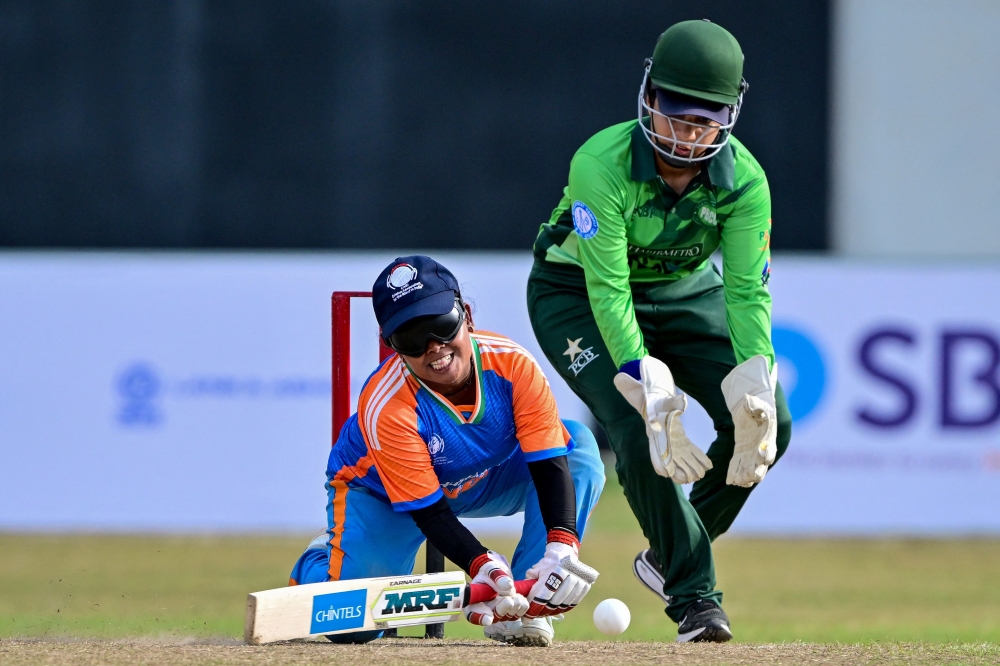(Files) India's Simu Das (L) plays a shot during the Women's Blind Twenty20 World Cup 2025 match between India and Pakistan at the BOI Cricket Stadium in Katunayake on November 16, 2025. (Photo by Ishara S. Kodikara / AFP)