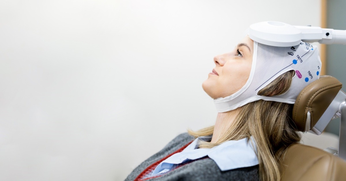A patient receiving advanced Repetitive Transcranial Magnetic Stimulation therapy.