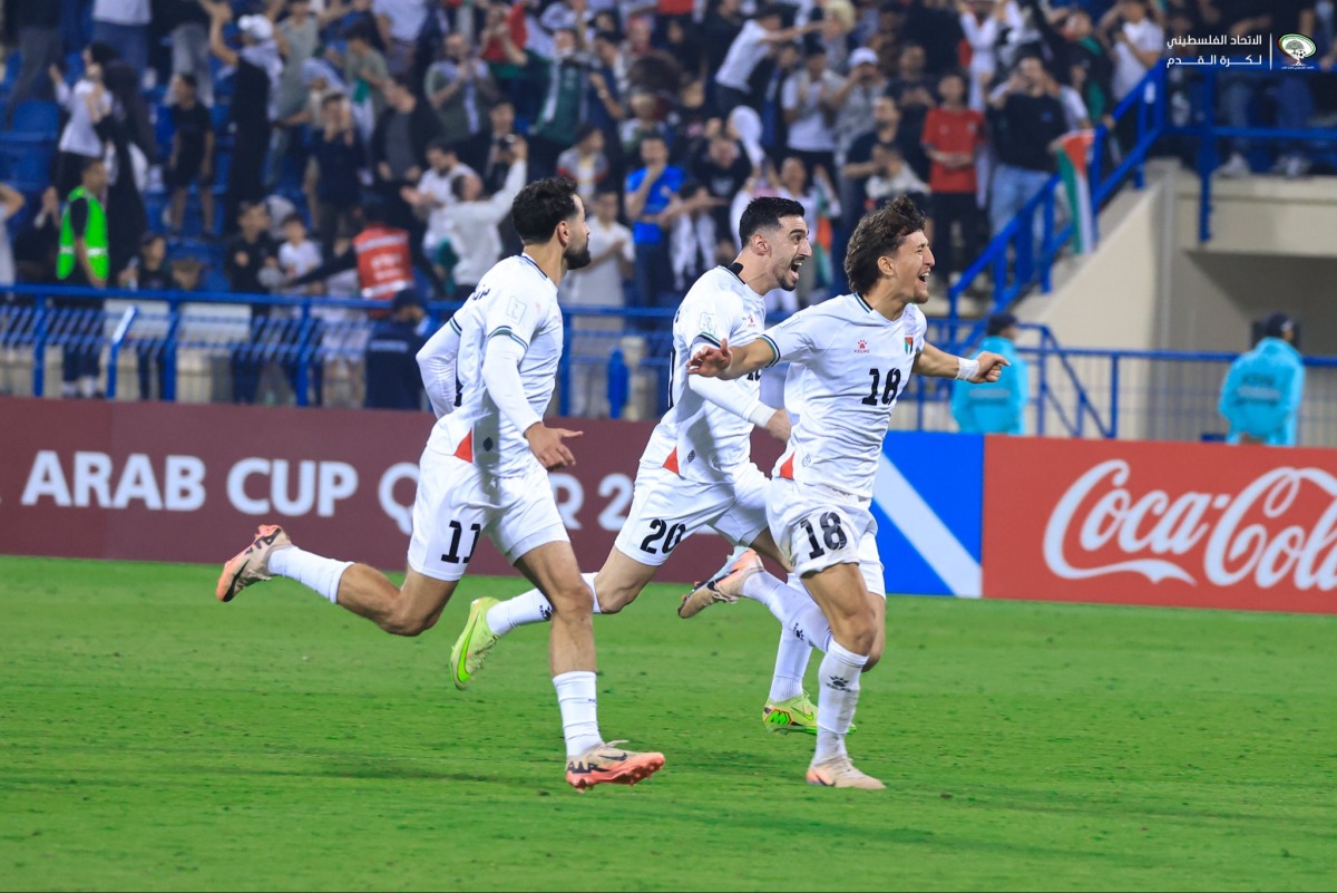Palestine players celebrate after defeating Libya in a penalty shootout at Thani bin Jassim Stadium yesterday. PIC: PFA
