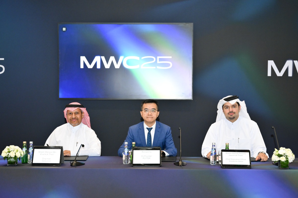 Vodafone Qatar CEO, Sheikh Hamad Abdulla Jassim Al Thani, Chairman of DVTT, Sheikh Mansoor Khalifa K A Al-Thani, and Co-founder and Senior Vice-President at iFLYTEK Richard Yu, during the MoU signing.