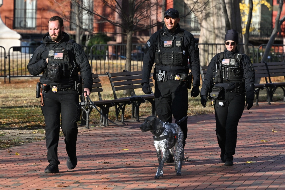 Secret Service uniformed division officers patrol in Lafayette Square across from the White House, in Washington, DC on November 27, 2025. Two National Guard troops were shot November 26 in a 