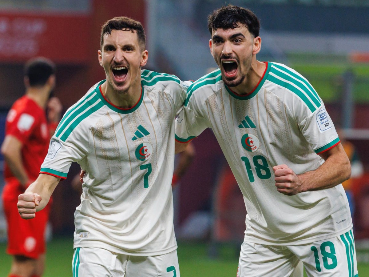 Adil Boulbina (left) and Redouane Berkane celebrate after scoring a goal.